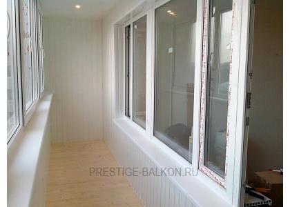 Теплое остекление балкона профилем rehau с утеплением и деревянной отделкой в Пушкино