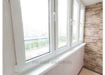 Тёплое остекление балкона профилем КВЕ и комбинированной отделкой пластиком и деревом в Пушкино