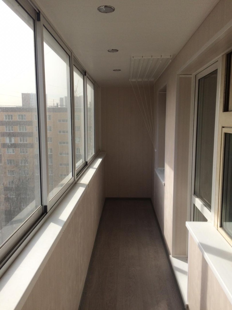 Теплое остекление балкона профилем KBE и установка сушилки в Пушкино